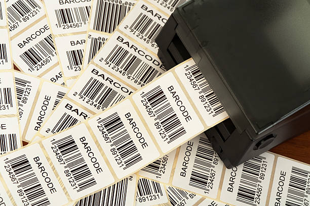 Barcode label printer with the labels ribbon, close-up. All about bar-codes in my lightbox: